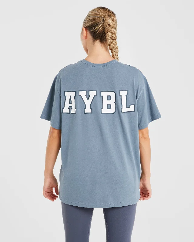 Varsity Statement Oversized T Shirt - Slate Blue Welt Pockets Slit Pockets Flap Pockets